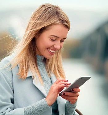 Woman texting outside