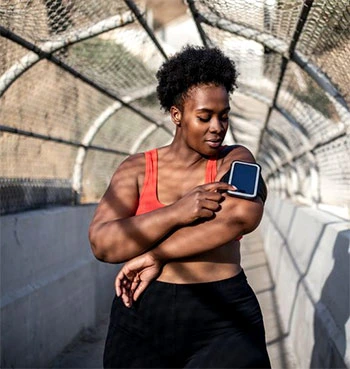 Woman using phone before running