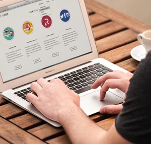 Man typing on MacBook laptop