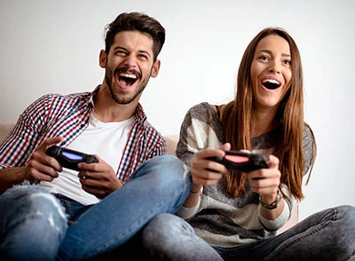 Couple playing exciting video game