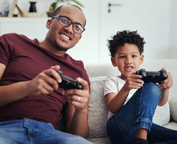 Dad and son playing video game