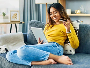 Woman shopping online on iPad device