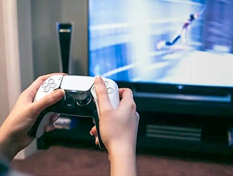 Person playing Playstation game