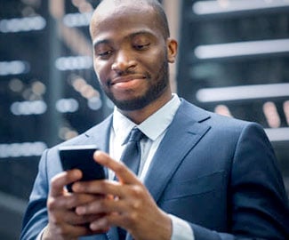 Business Man checking Smartphone